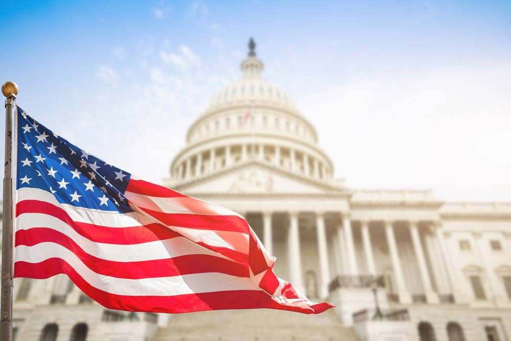 civic engagement - US flag in front of the Capitol building
