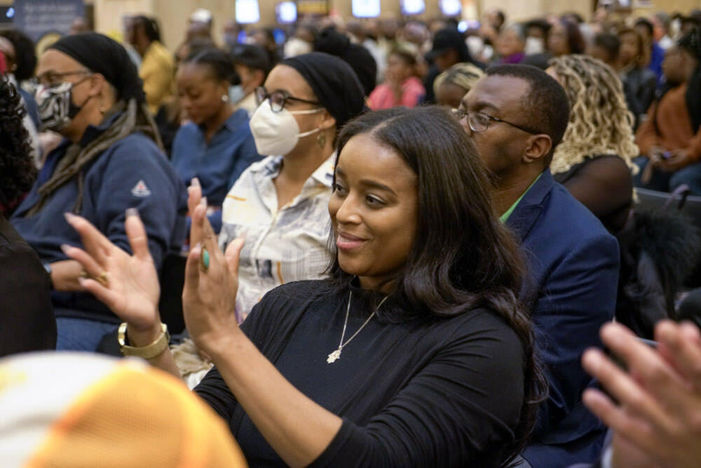 audience members clapping at a library event