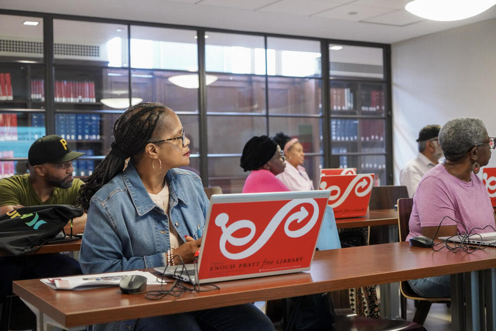 Computer class - people listening with Pratt Library laptops