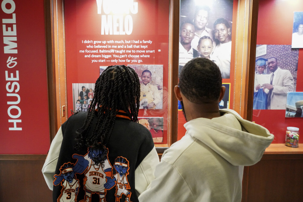 House of Melo exhibit at Pratt Library - people looking at photos