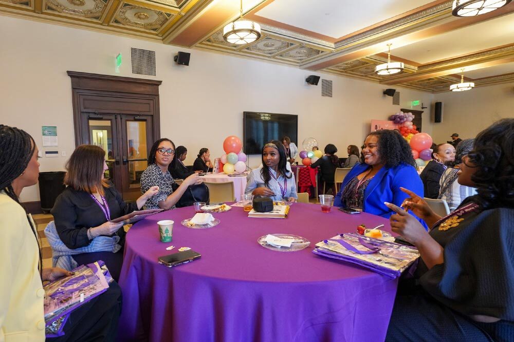 Women in Workforce Luncheon group with purple tablecloth